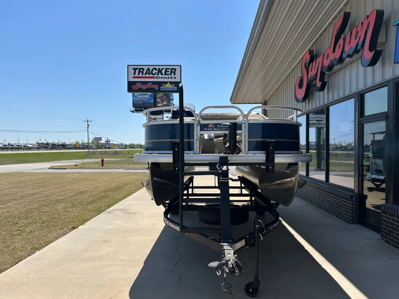 Slide: The Image of 2023 Sun Tracker BB 18 DLX boat displayed outside a dealership. - 11