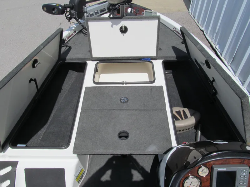 Slide: The Image of 2005 Ranger 185 VX boat interior with storage compartments and control panel. - 11