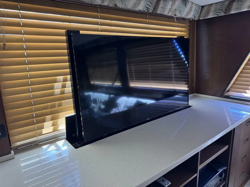 Slide: The Image of Flat-screen TV on a Hatteras Enclosed Bridge yacht, 1985 model, with wooden blinds. - 6