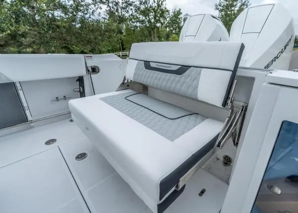 Slide: The Image of 2024 Blackfin 272 boat with luxurious seating and dual Mercury engines. - 8
