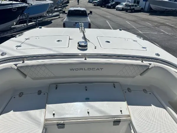 Slide: The Image of 2023 World Cat 260 CC-X boat deck, featuring storage compartments and sleek design. - 14