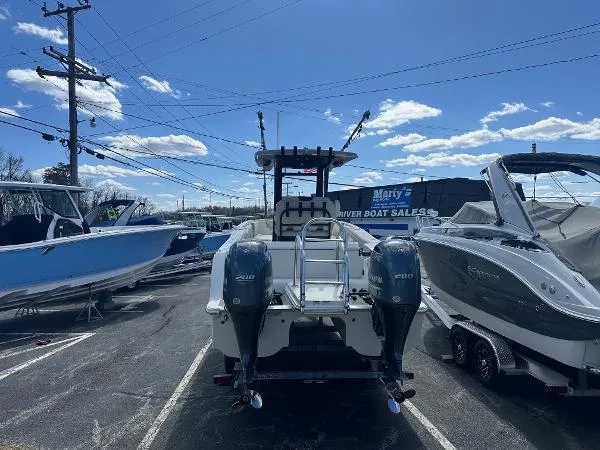 Slide: The Image of 2023 World Cat 260 CC-X boat with dual engines in a dealership lot. - 6