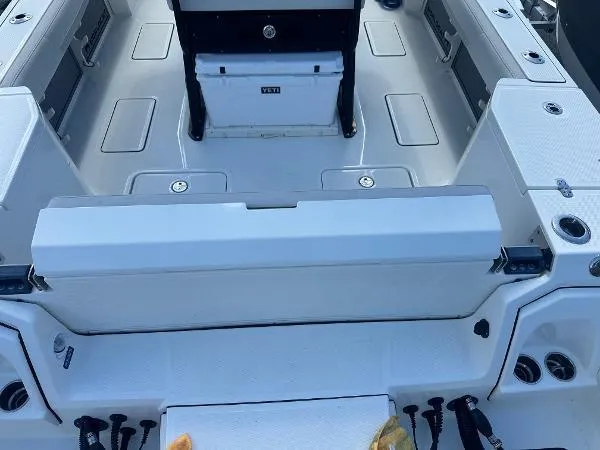 Slide: The Image of 2023 World Cat 260 CC-X boat interior with seating and storage compartments. - 7