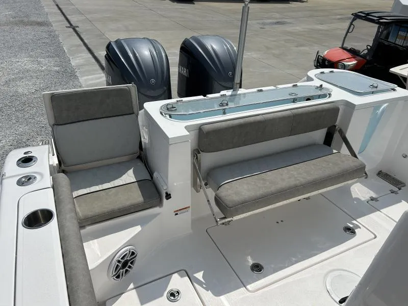 Slide: The Image of 2024 Sea Fox 328 Commander boat interior with seating and dual Yamaha engines. - 10
