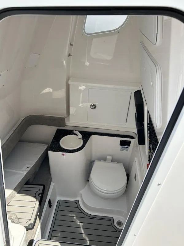 Slide: The Image of 2024 Sea Fox 328 Commander boat interior with toilet and sink. - 11