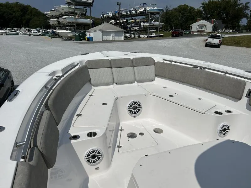 Slide: The Image of 2024 Sea Fox 328 Commander boat interior with cushioned seating and speakers. - 12