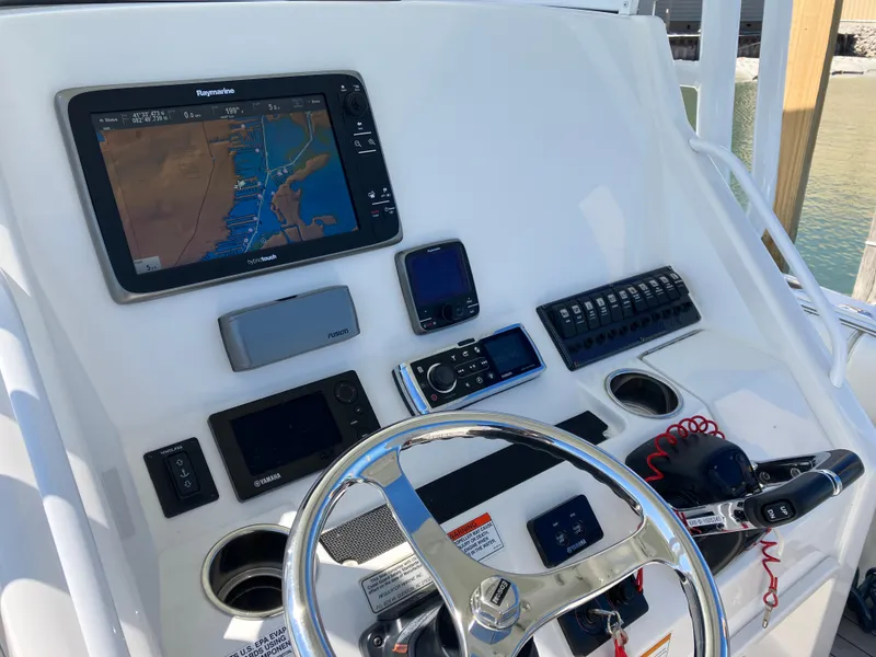 Slide: The Image of Control panel of a 2013 Regulator 28 boat with navigation equipment. - 10