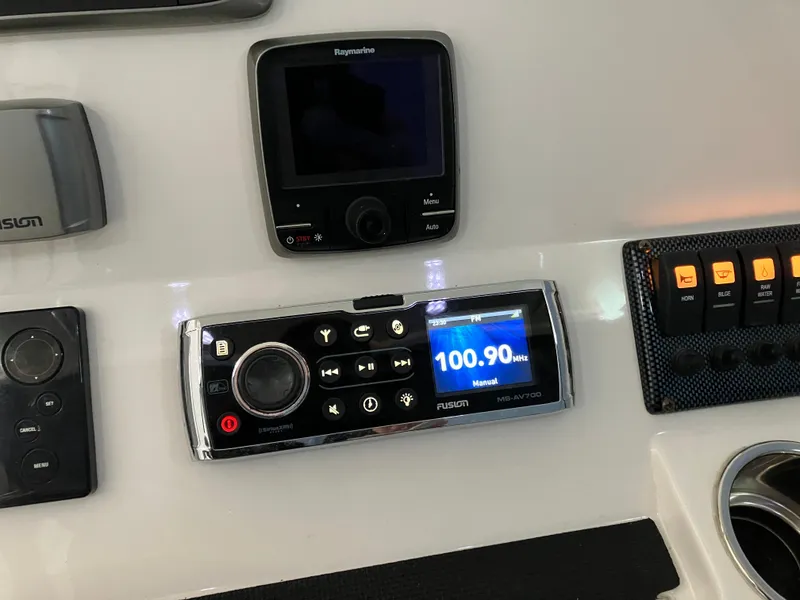 Slide: The Image of Control panel of a 2013 Regulator 28 boat with radio and navigation display. - 14