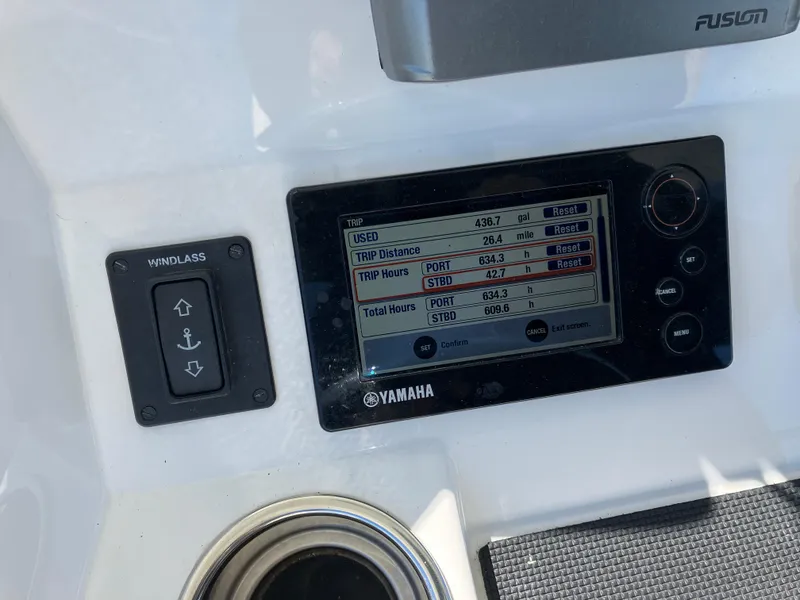 Slide: The Image of Control panel of a 2013 Regulator 28 boat with Yamaha display and windlass switch. - 31