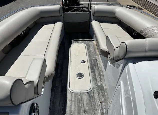 Slide: The Image of 2019 Crest Savannah 250 SLS pontoon boat interior with spacious seating and modern design. - 10