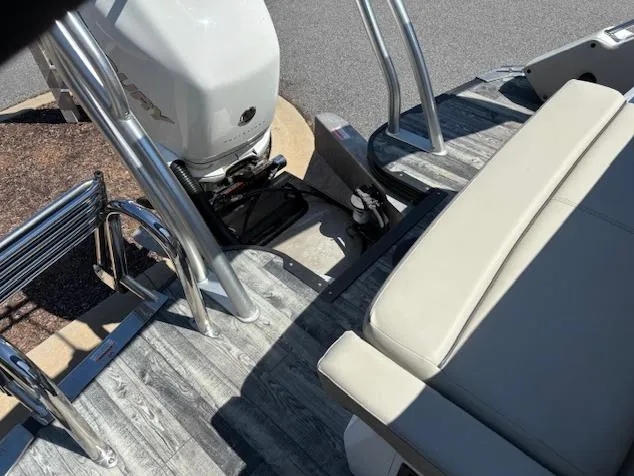 Slide: The Image of 2019 Crest Savannah 250 SLS boat interior with seating and motor, featuring sleek design elements. - 11