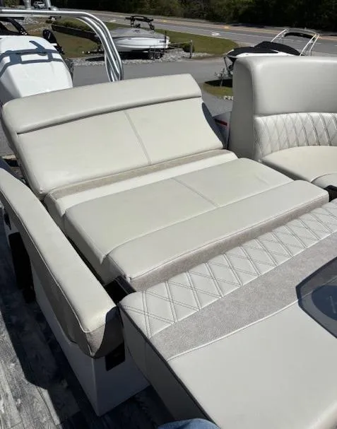 Slide: The Image of 2019 Crest Savannah 250 SLS boat with luxurious beige seating and elegant design. - 14