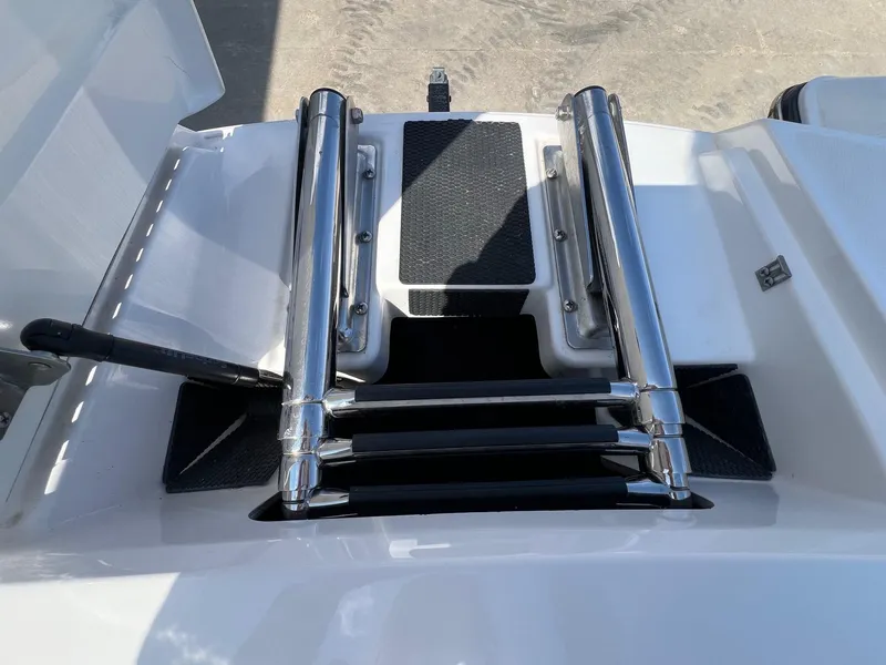 Slide: The Image of 2013 MasterCraft X-25 boat ladder with stainless steel rails and non-slip steps. - 14