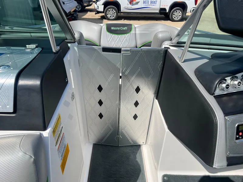 Slide: The Image of Interior view of a 2013 MasterCraft X-25 boat, featuring sleek design and luxury seating. - 17
