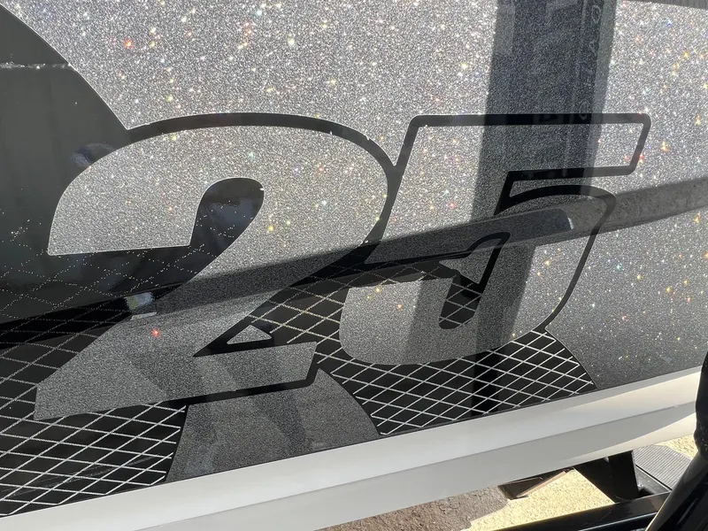 Slide: The Image of Close-up of 2013 MasterCraft X-25 boat with glittery '25' decal design. - 2