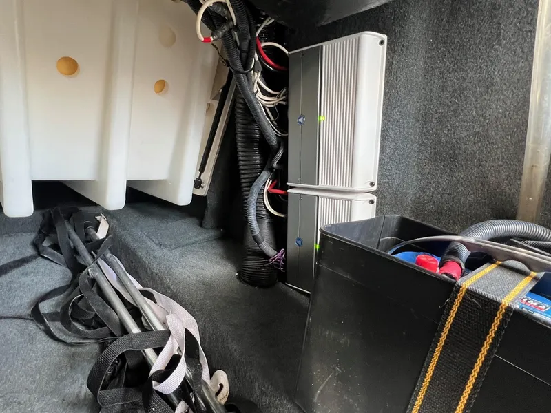Slide: The Image of Interior of a 2013 MasterCraft X-25 boat showing wiring and equipment storage. - 29