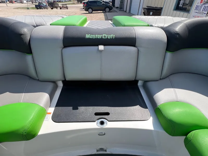 Slide: The Image of 2013 MasterCraft X-25 boat interior with gray and green seating. - 37