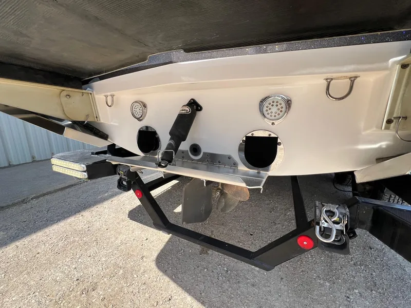Slide: The Image of 2013 MasterCraft X-25 boat stern with propeller and exhaust system visible. - 8
