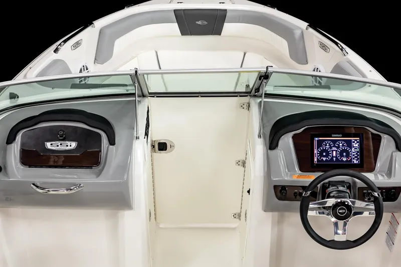 Slide: The Image of 2025 Chaparral 21 SSi OB boat dashboard with steering wheel and digital display. - 15