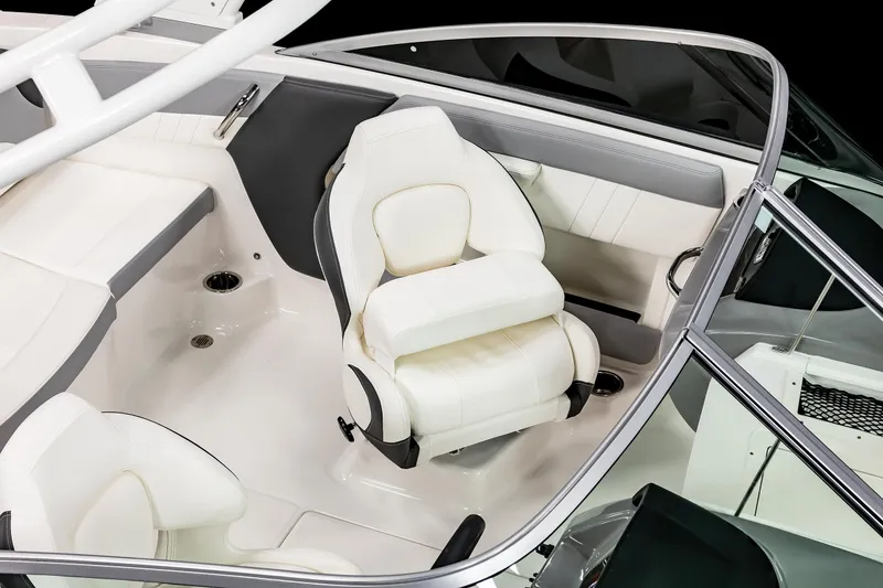 Slide: The Image of 2025 Chaparral 21 SSi OB boat interior with white seating and sleek design. - 18