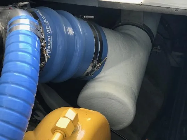 Slide: The Image of Engine compartment of 1999 Provincial 42 Fishing Boat with blue silicone hoses. - 13