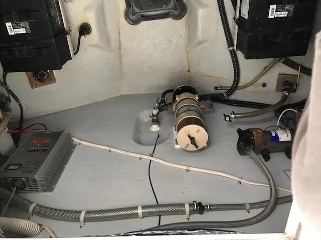 Slide: The Image of Engine room of a 1999 Provincial 42 Fishing Boat with visible wiring and equipment. - 14