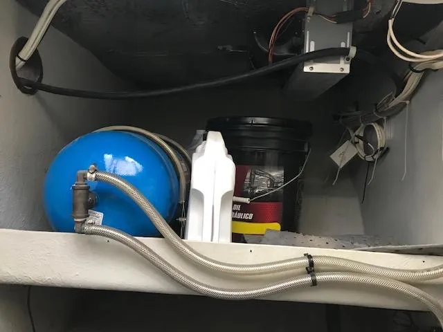 Slide: The Image of Storage compartment on a 1999 Provincial 42 Fishing Boat with equipment and supplies. - 19