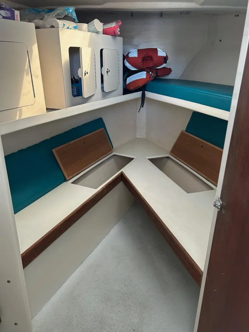 Slide: The Image of Interior cabin of a 1999 Provincial 42 Fishing Boat with storage and seating. - 23