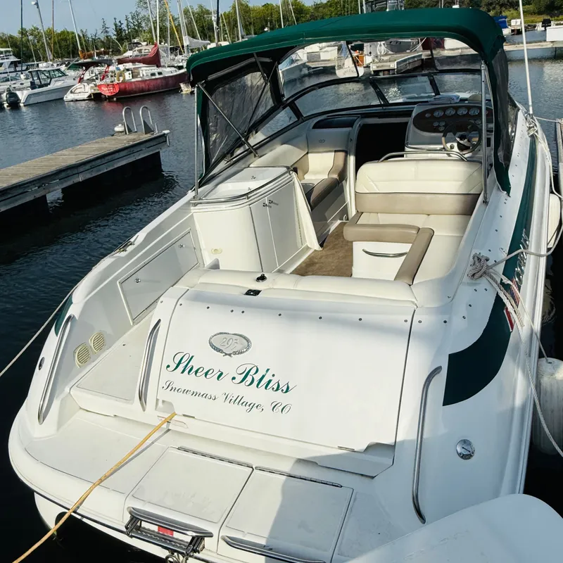 Slide: The Image of Cobalt 293 boat from 2000, named "Sheer Bliss," docked at a marina. - 5