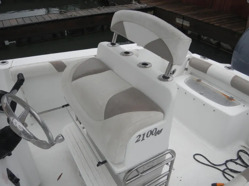 Slide: The Image of 2007 Polar 2100 Center Console boat interior with steering wheel and seating. - 11