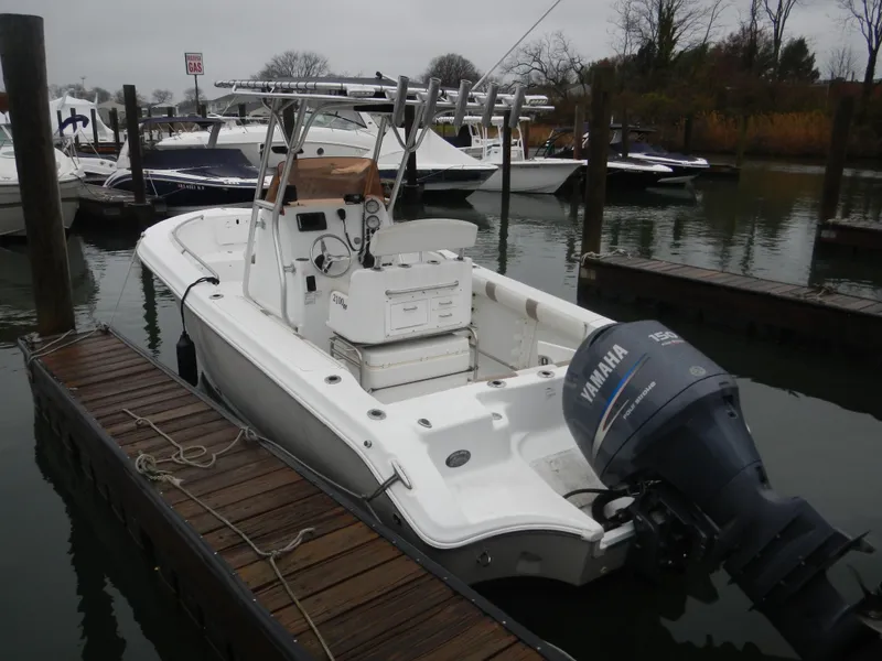 Slide: The Image of 2007 Polar 2100 Center Console boat docked, featuring Yamaha outboard motor. - 2