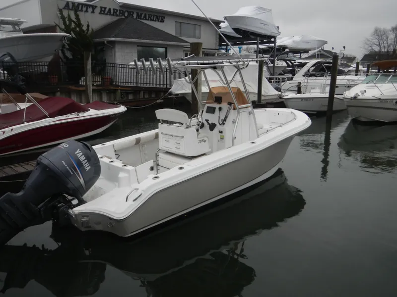 Slide: The Image of 2007 Polar 2100 Center Console boat docked at marina with Yamaha outboard motor. - 3