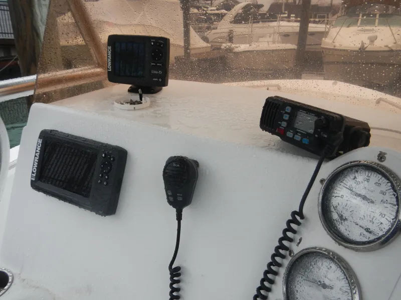 Slide: The Image of 2007 Polar 2100 Center Console boat dashboard with navigation and communication equipment. - 6