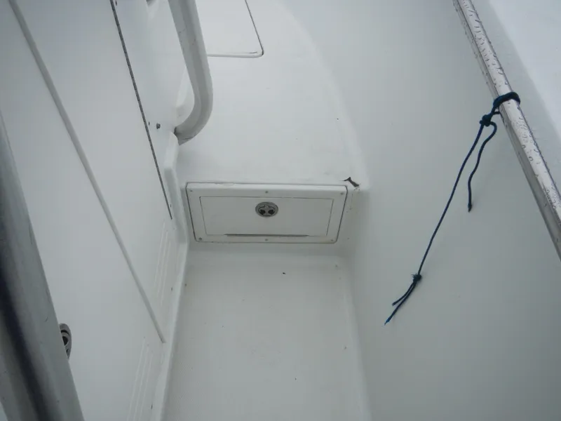 Slide: The Image of 2007 Polar 2100 Center Console boat interior with storage compartment and railing. - 7