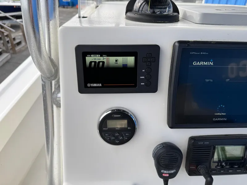 Slide: The Image of Control panel of a 2016 Parker 2300 Special Edition boat with Yamaha and Garmin displays. - 12