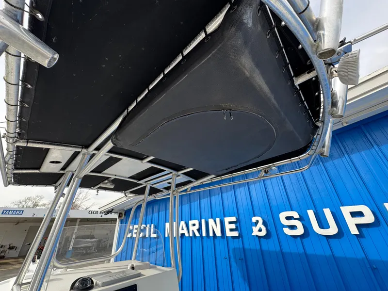 Slide: The Image of 2016 Parker 2300 Special Edition boat with T-top at marine supply store. - 19