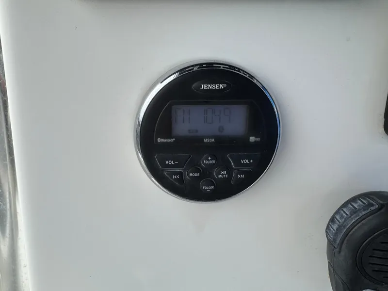 Slide: The Image of Jensen radio display on 2016 Parker 2300 Special Edition boat dashboard. - 20