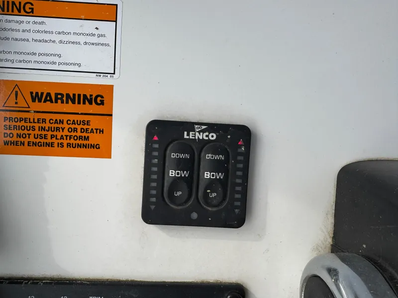 Slide: The Image of Control panel on a 2016 Parker 2300 Special Edition boat with warning label. - 21