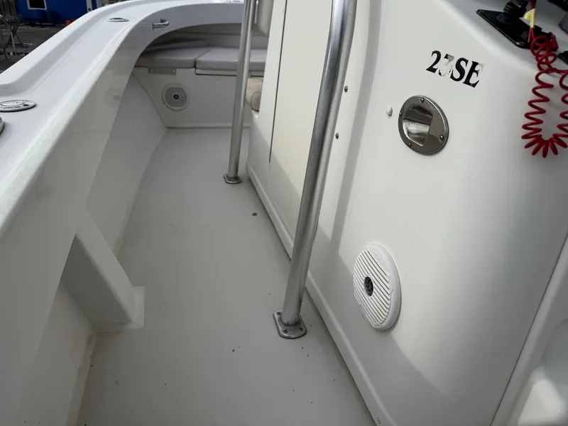 Slide: The Image of 2016 Parker 2300 Special Edition boat interior with clean white deck and safety railing. - 22