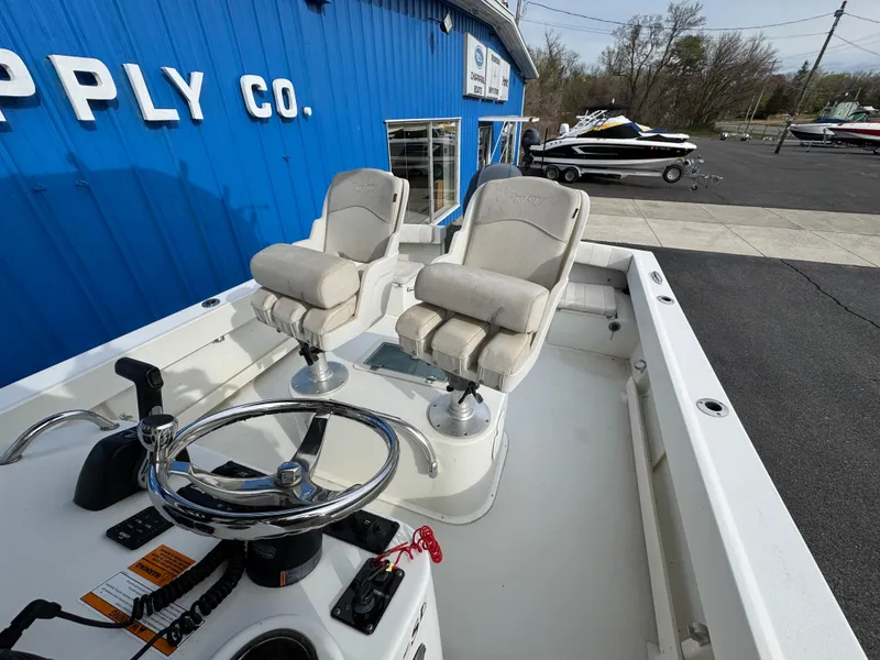 Slide: The Image of 2016 Parker 2300 Special Edition boat with dual seats at a marine supply store. - 24