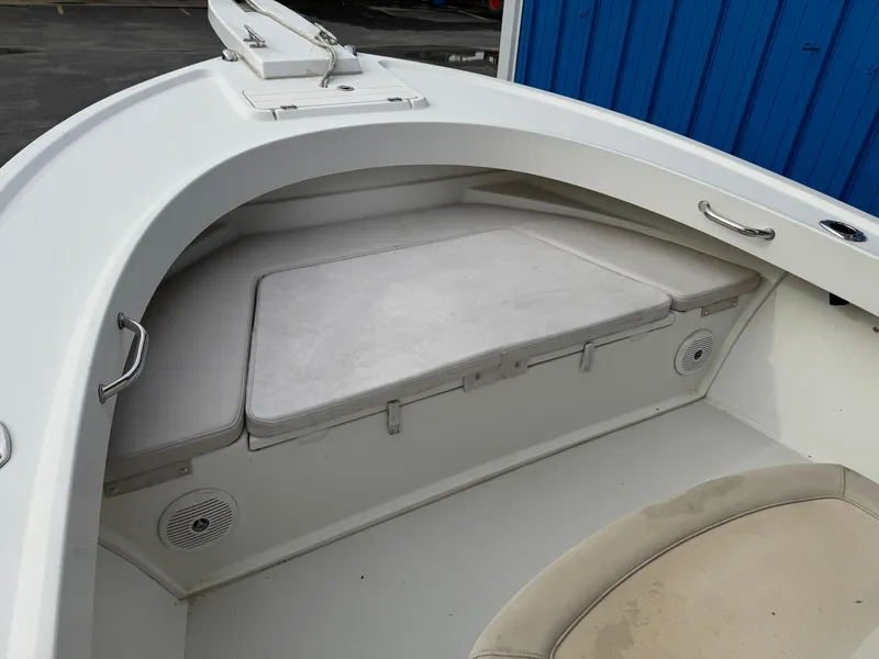 Slide: The Image of 2016 Parker 2300 Special Edition boat interior with cushioned seating and storage. - 28