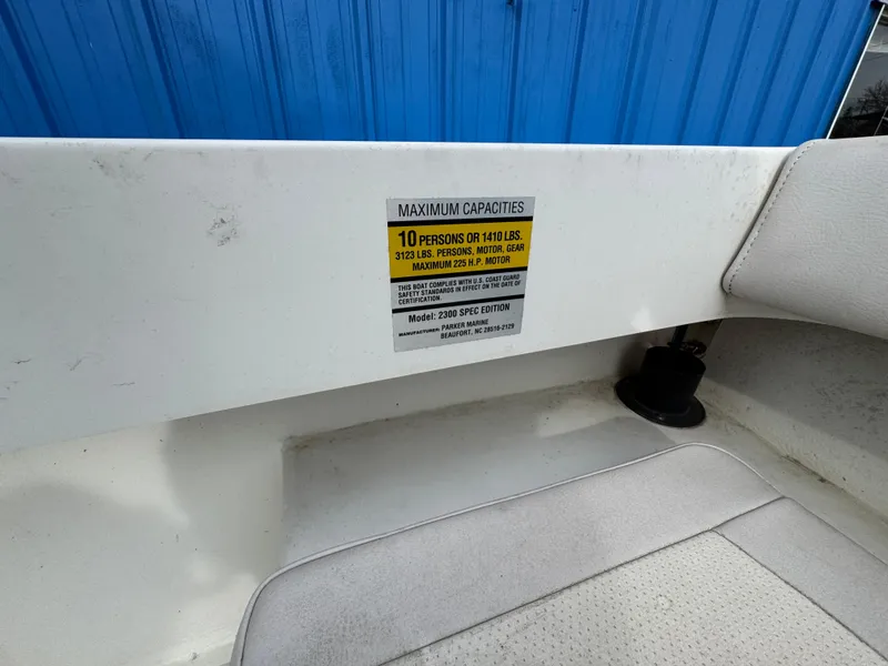 Slide: The Image of 2016 Parker 2300 Special Edition boat capacity label, blue background, white interior. - 31