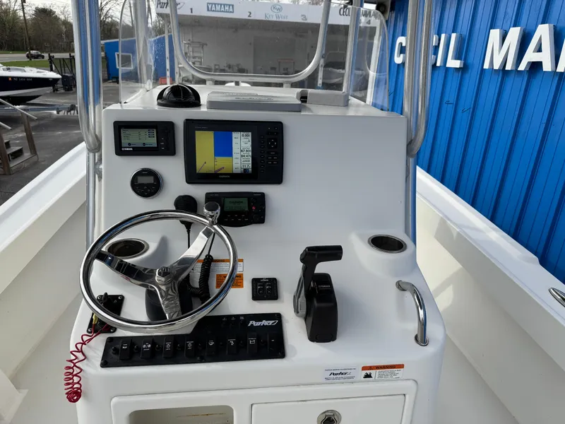Slide: The Image of Center console of 2016 Parker 2300 Special Edition boat with navigation equipment. - 8