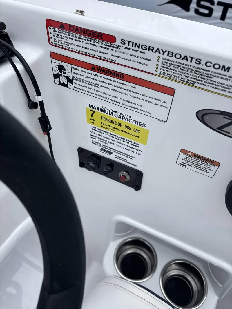 Slide: The Image of 2025 Stingray 172 SC boat dashboard with safety warnings and capacity details. - 20