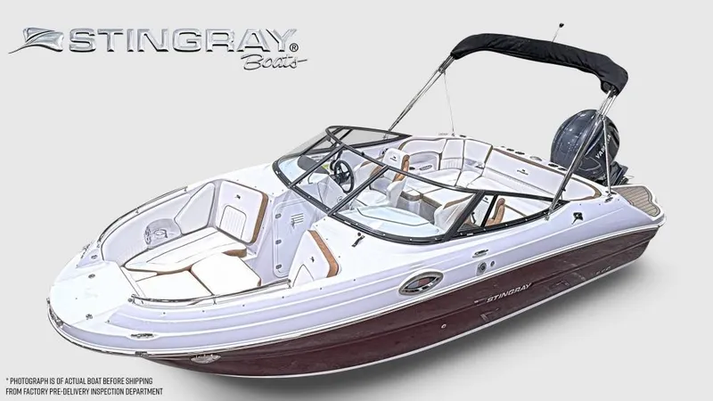 Slide: The Image of 2025 Stingray 211 DC boat with sleek design and modern features, white and maroon color scheme. - 1