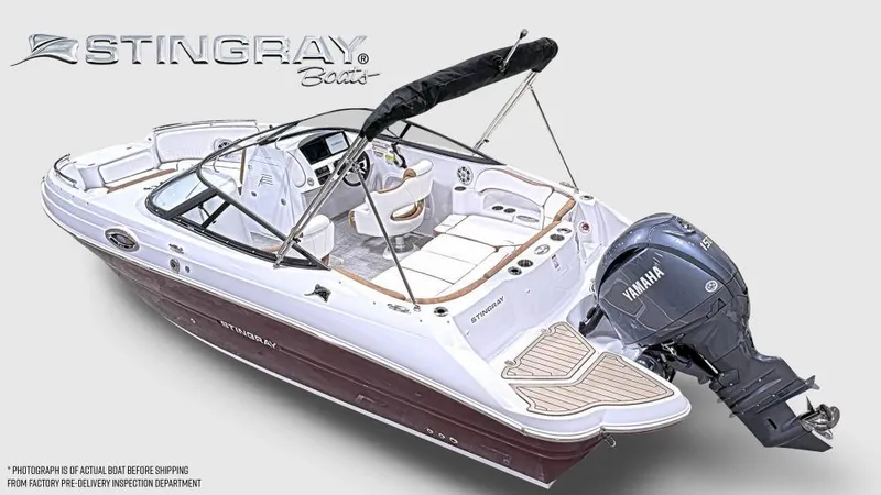 Slide: The Image of 2025 Stingray 211 DC boat with Yamaha engine, featuring sleek design and spacious seating. - 2