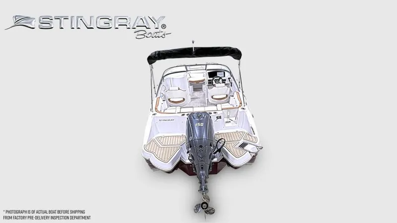 Slide: The Image of 2025 Stingray 211 DC boat with outboard motor, top view, showcasing sleek design and spacious seating. - 4