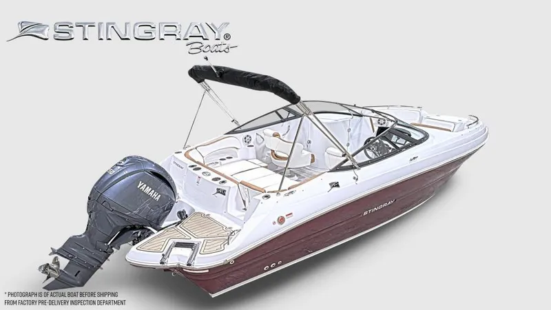 Slide: The Image of 2025 Stingray 211 DC boat with Yamaha outboard motor, featuring sleek design and spacious interior. - 5