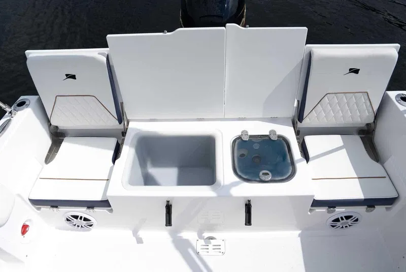 Slide: The Image of 2025 Stingray 173 CC boat interior with seating, storage, and sink. - 13