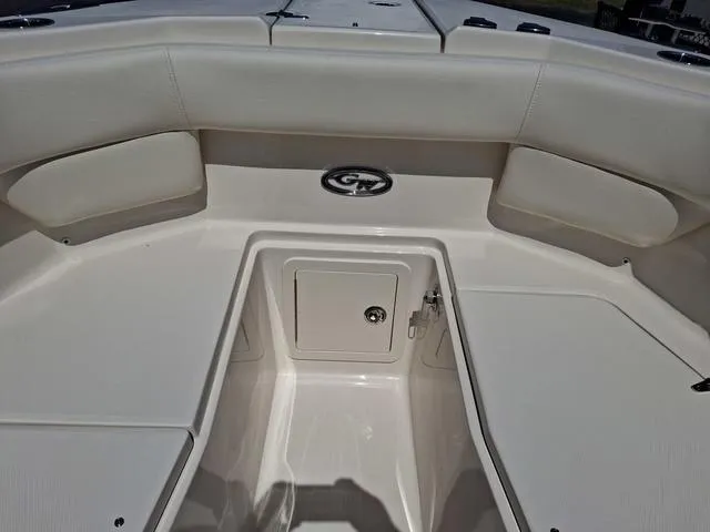 Slide: The Image of 2025 Grady-White Freedom 307 boat interior with seating and storage compartment. - 12
